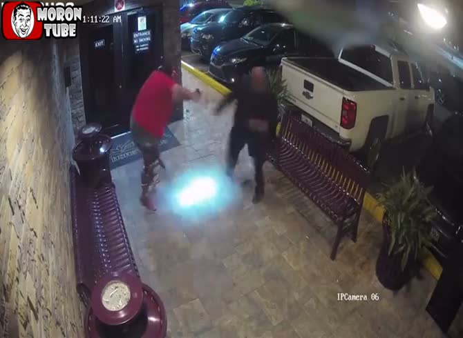Video :A guy brandishing a rifle and donning a devil mask attempts to enter a strip club